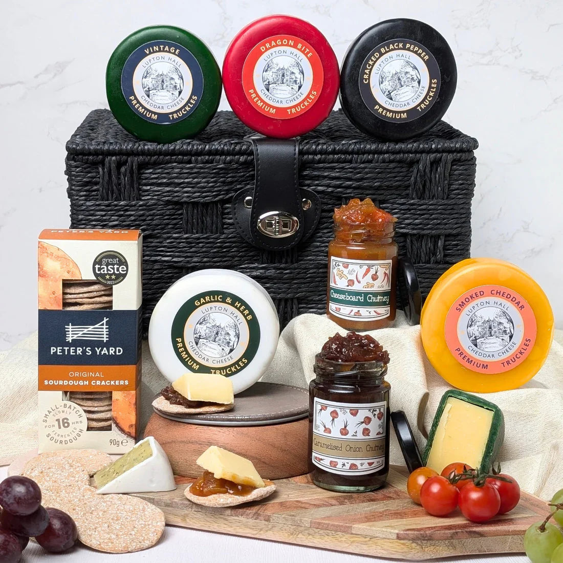 Luxury cheese hamper with waxed cheddar truckles, sourdough crackers and chutney gift set in the UK