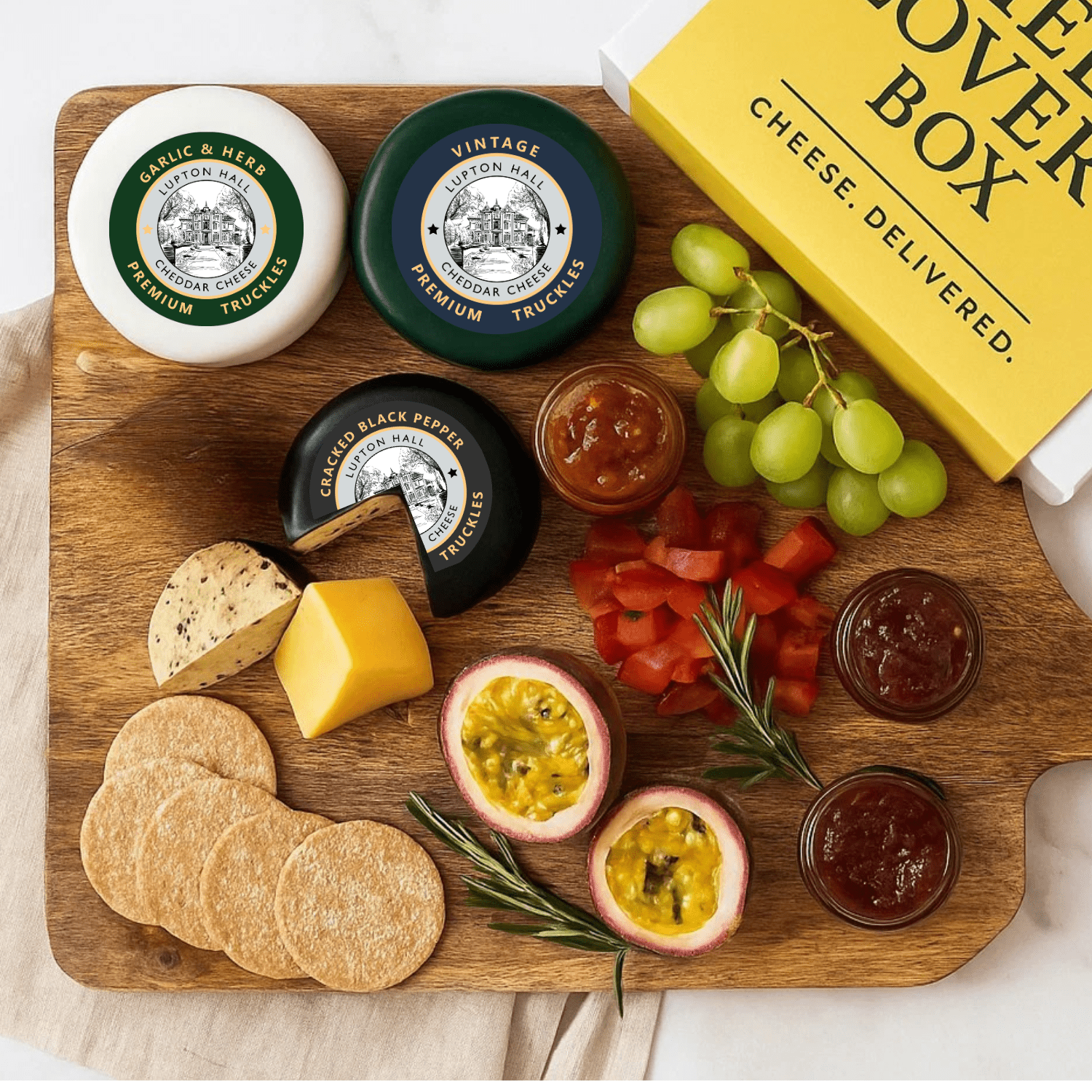 cheese gift box laid out on a cheese board