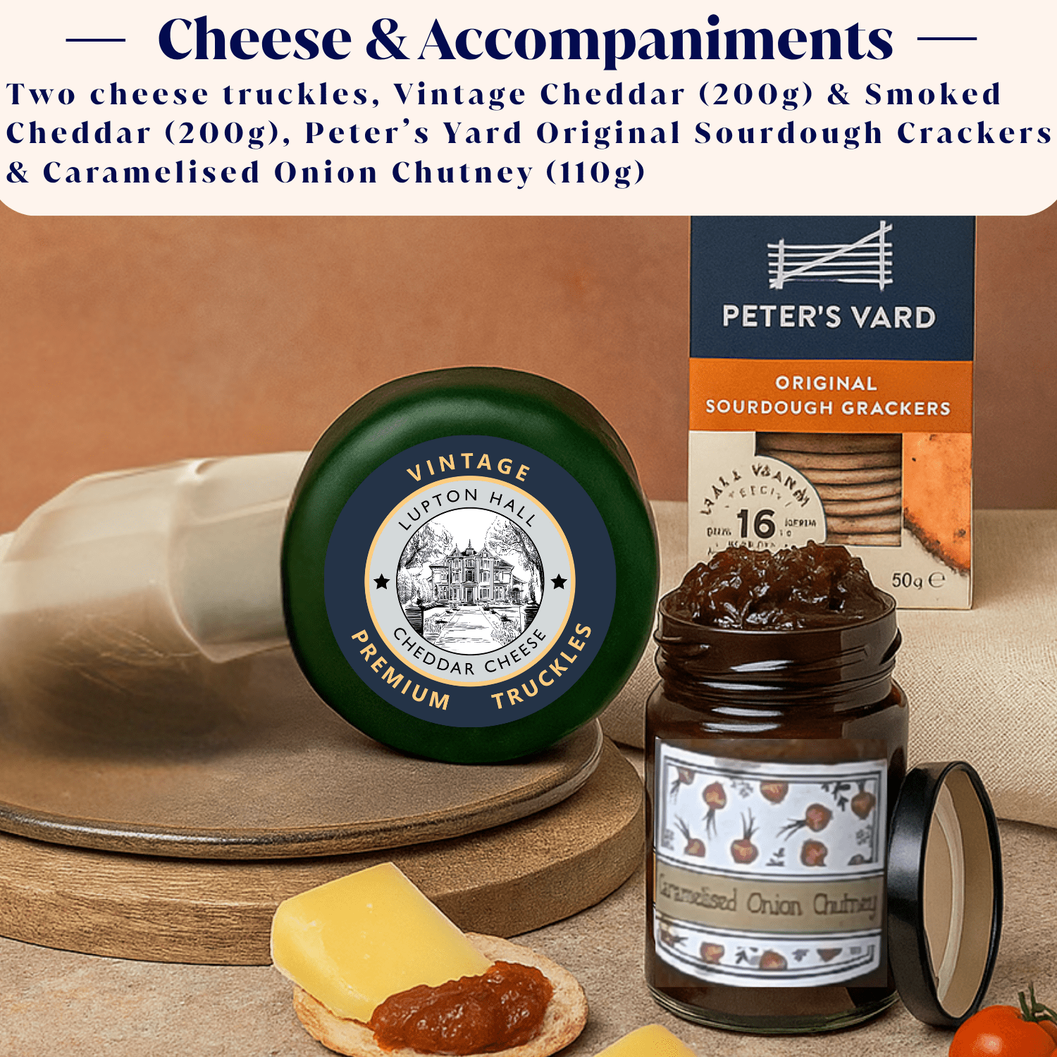 Assorted cheese and crackers set with vintage cheddar truckles, smoked cheddar truckles, crackers, and chutney on a wooden board.