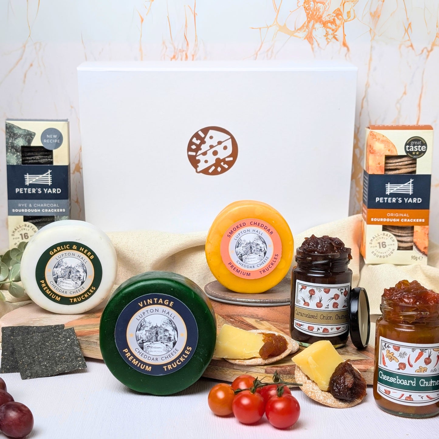 Luxury Cheese Gift Box with artisan cheeses, chutneys, and crackers, beautifully presented in a white magnetic close box—perfect for gifting.