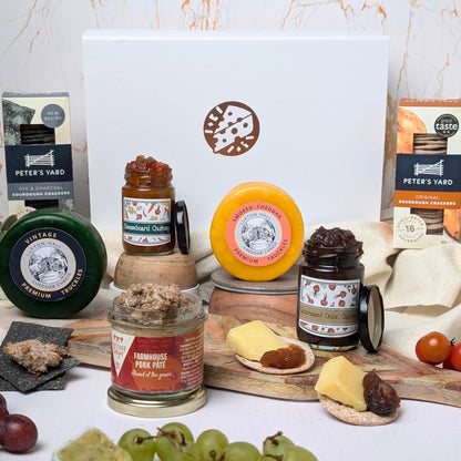 Luxury Cheese & Pâté Gift Box with artisan cheeses, farmhouse pork pâté, crackers, and chutneys, elegantly presented in a white magnetic close box—ideal for gourmet gifting.