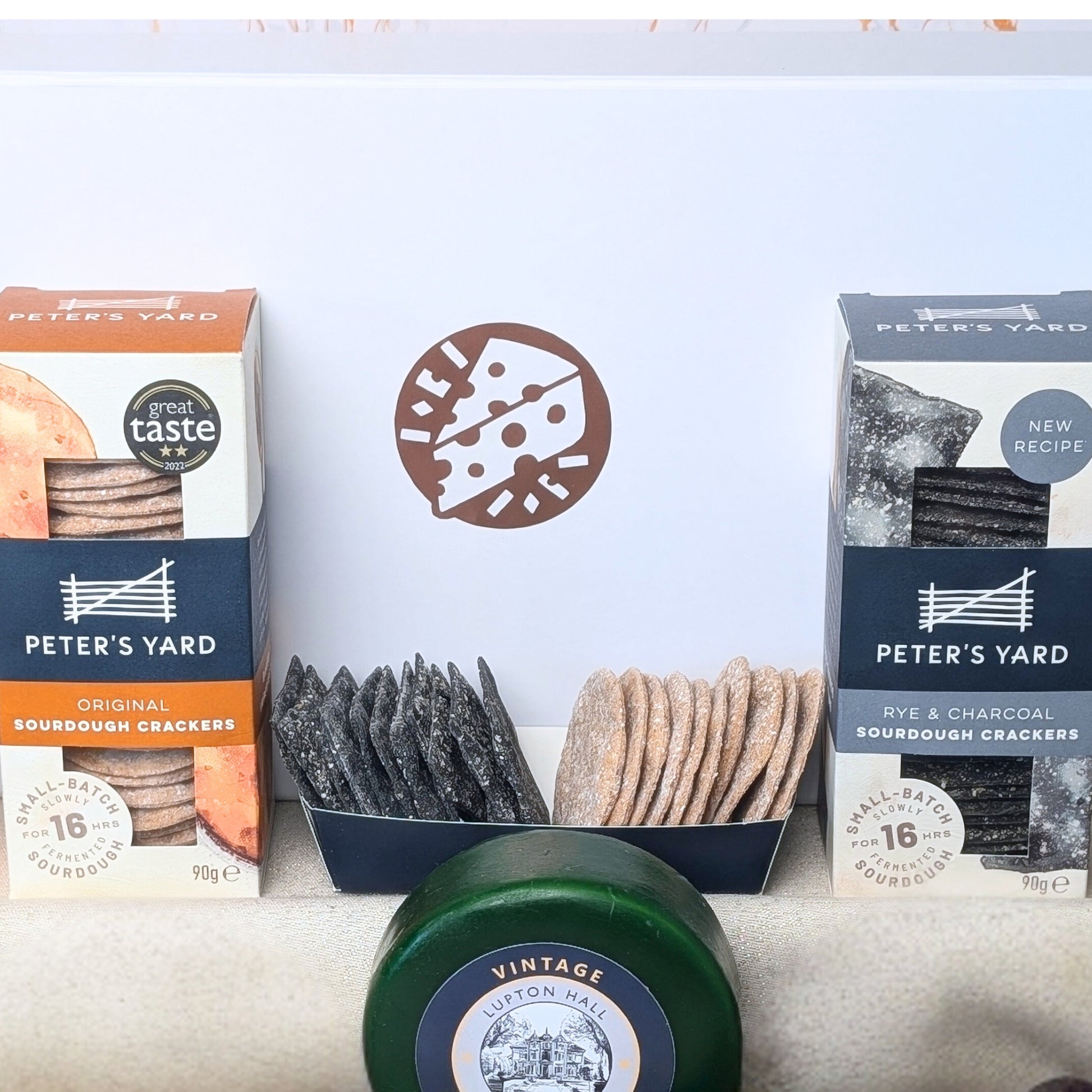 Crisp sourdough crackers paired with rich farmhouse chutney, perfectly complementing the artisan cheeses and pâté in the Luxury Cheese & Pâté Gift Box.