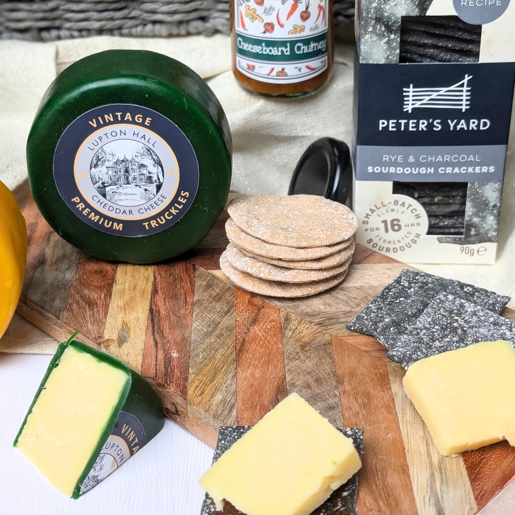 Handcrafted sourdough crackers and gourmet chutneys, including Caramelised Onion Chutney and Cheeseboard Chutney, designed to complement artisan cheeses